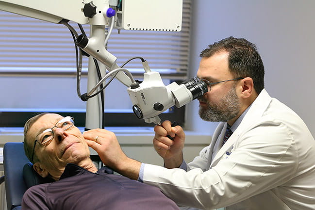 Dr. Habib Rizk examining a patient