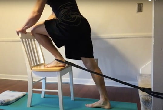 Physical Therapist Aaron Brown demonstrates ankle dorsiflexion, a mobilization with movement technique