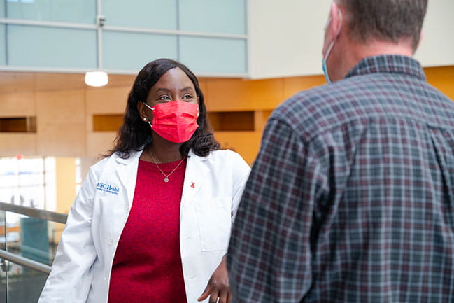 Dr. Sharee Wright talking to a patient