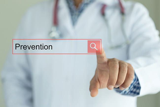 Doctor pointing at the word prevention