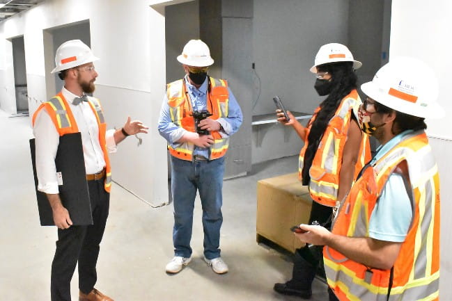 People in safety gear taking tour of Black River Medical Center