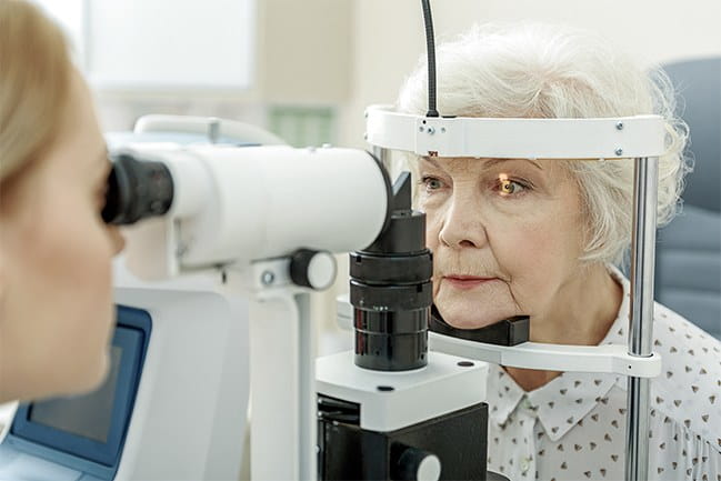 An optometrist examining a patient's eyes.