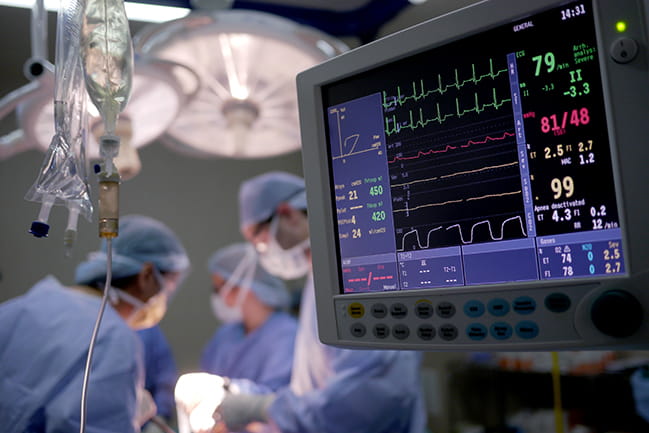 Operating room with computer monitor in the foreground.