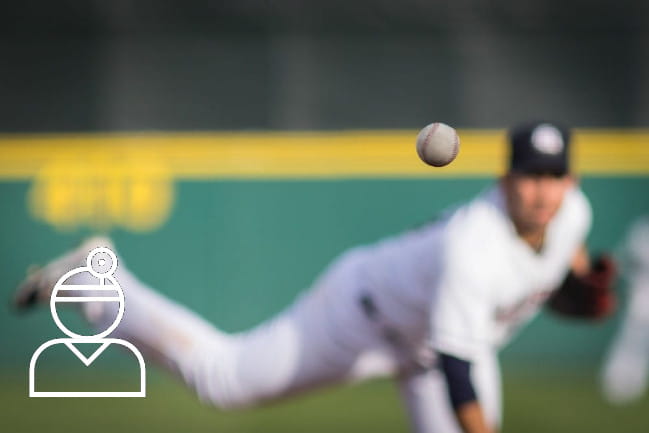 Pitcher throwing a baseball.