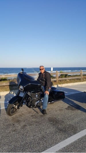 Mark Sims on a motorcycle
